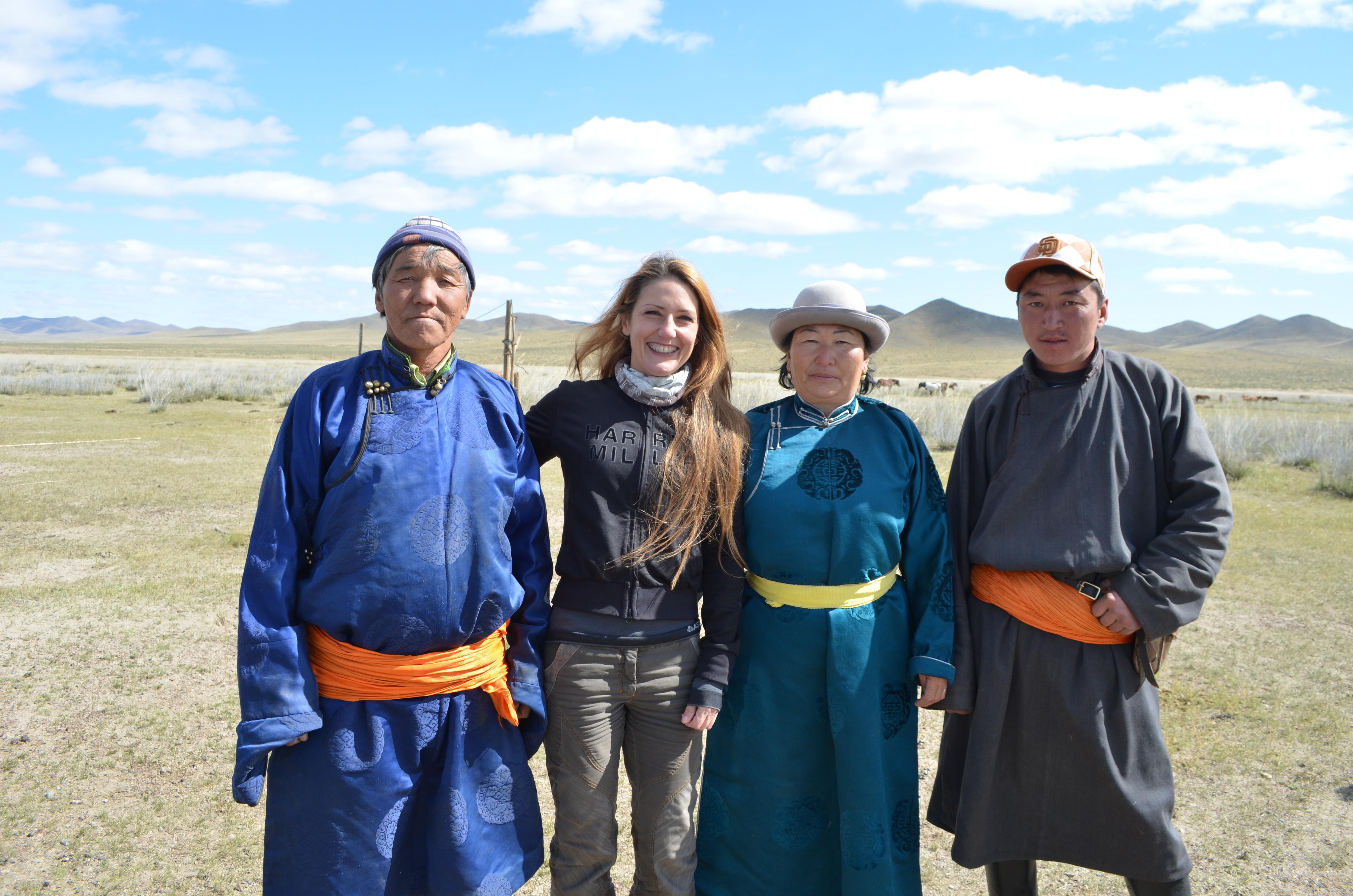 Female Projects Abroad Nomad Project Volunteer poses outside with Mongolian Nomads during her Cultural immersion project in Mongolia. Female Culture and Community Volunteer poses with Mongolian Nomads during a Volunteering project.